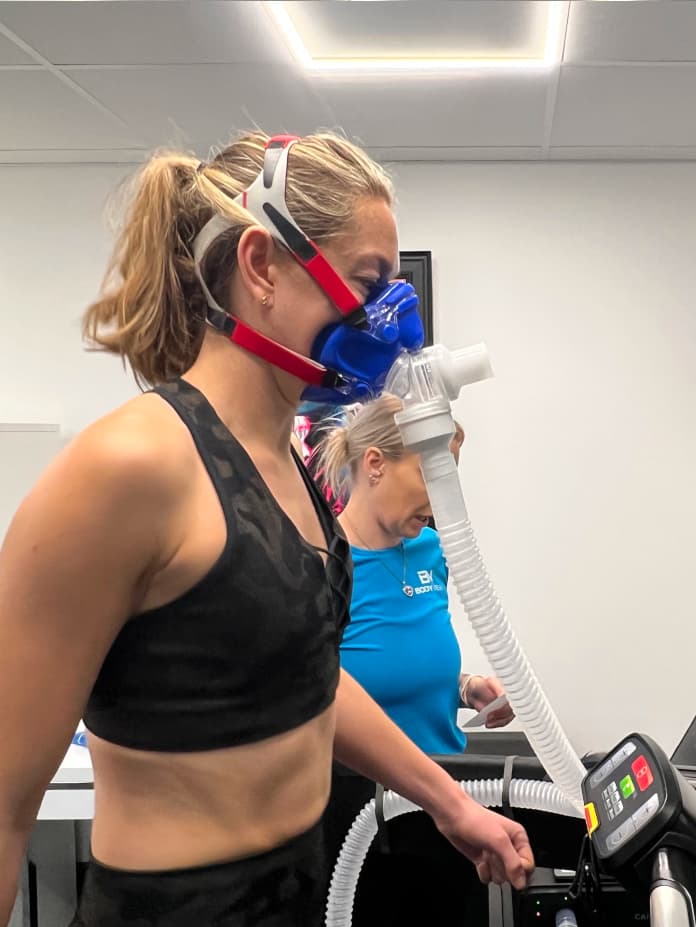 A customer demonstrating the VO2 Max Mask