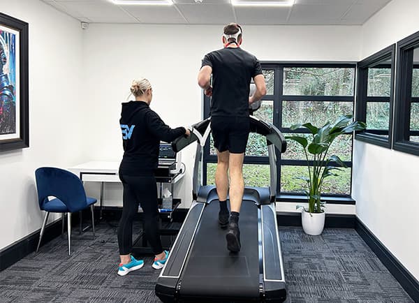A customer running on a treadmill during a vo2 max test