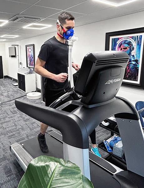 A customer running on a treadmill during a vo2 max test